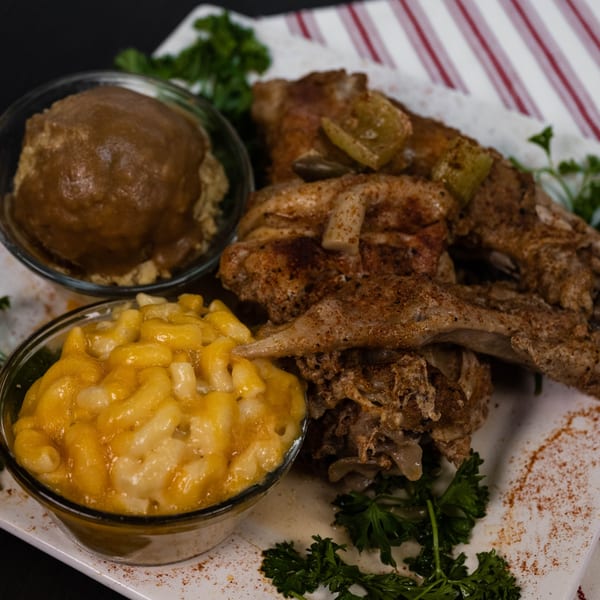 Detroit Soul's baked chicken with mac and cheese and mashed potatoes with gravy.