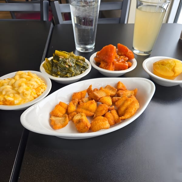 Detroit Soul's fried catfish, mac and cheese, collard greens, candied yams, cornbread, and drinks.